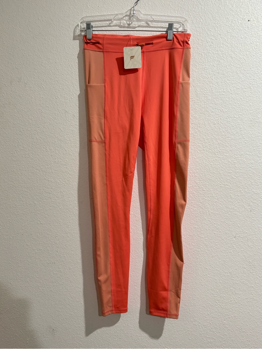 Fabletics Coral and Peach Colorblock Leggings